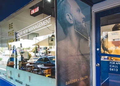 Exterior of Be The Man Barber in Melbourne, Victoria, AU showcasing modern design and barber services.