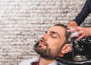 Client enjoys relaxing hair wash at Be The Man Barber, Melbourne, Victoria, AU.