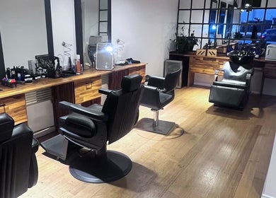 Elegant barber chairs at Be The Man Barber, Melbourne, Victoria, AU, showcasing a sleek, modern interior.