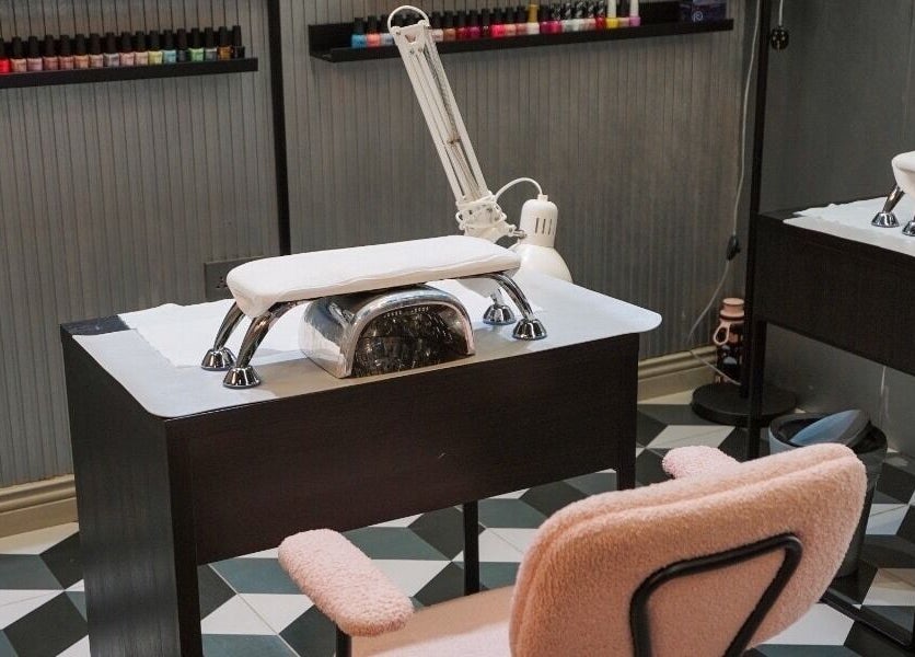 Manicure station at Vog Beauty Salon For Ladies in دبي, دبي, AE, showcasing nail polish display and equipment.
