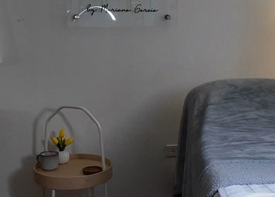 Tranquil massage room at Valórate Aesthetic in Gurabo, Gurabo, PR with plush bed and minimalist decor.