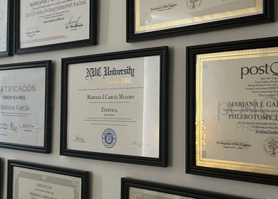 Wall of certifications at Valórate Aesthetic in Gurabo, Gurabo, PR, showcasing professional credentials.