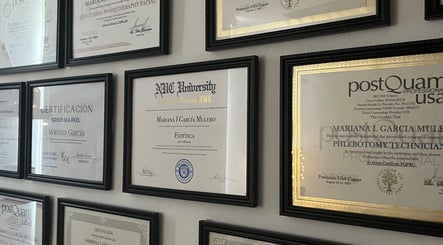 Wall of certifications at Valórate Aesthetic in Gurabo, Gurabo, PR, showcasing professional credentials.