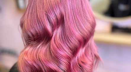 Vibrant pink wavy hairstyle at Hair by Lol, Birmingham, England, GB.