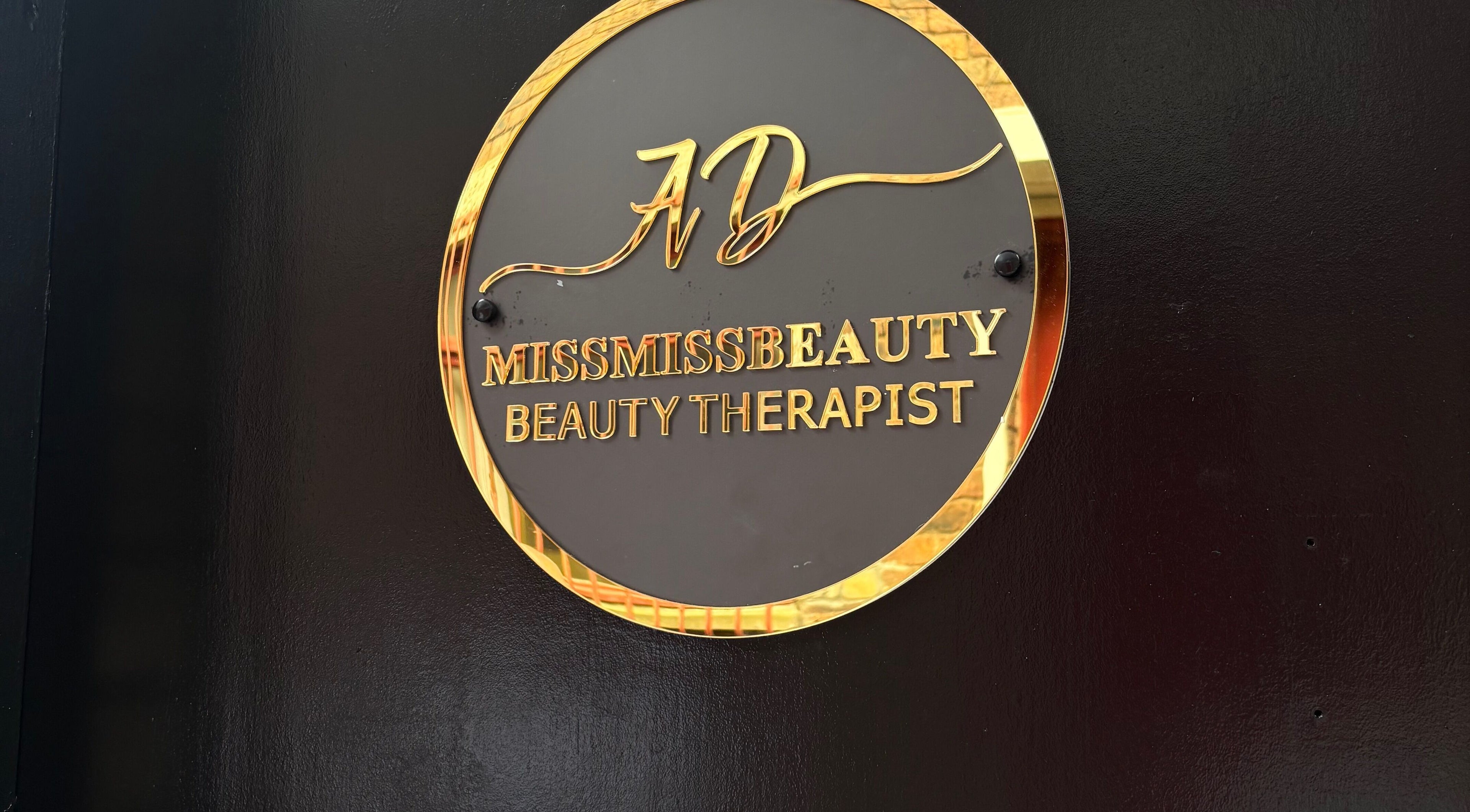 Gold plaque of Miss Miss Beauty, a beauty therapist in Cambuslang, Scotland, GB.