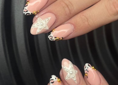 Intricate star and leopard nail art at Miss Miss Beauty, Cambuslang, Scotland, GB.