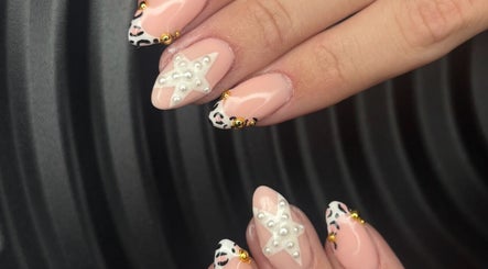Intricate star and leopard nail art at Miss Miss Beauty, Cambuslang, Scotland, GB.
