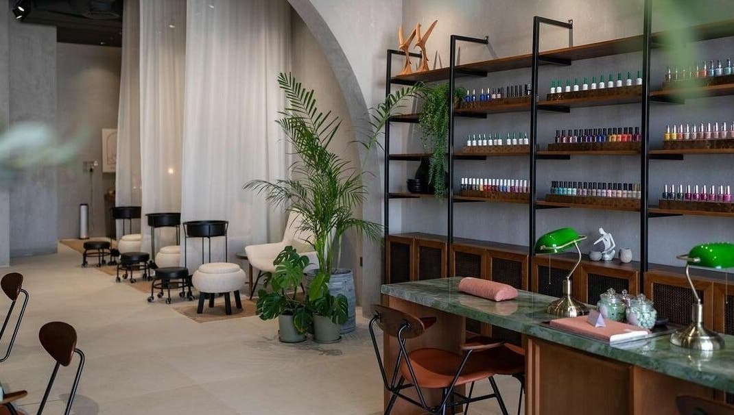 Modern interior of Dry by Spa in Riyadh, SA featuring nail polish displays and elegant seating areas.