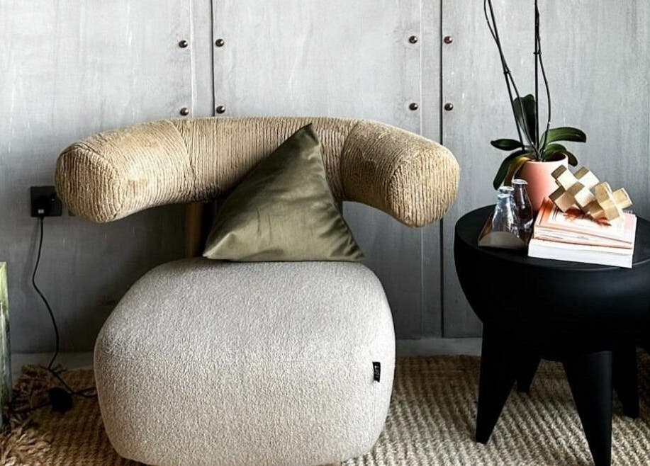 Inviting lounge area at Dry by Spa, Riyadh, SA, showcasing modern chair and chic decor.