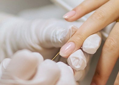 Close-up of a manicure session at Set Studio in Manchester, GB, showcasing glossy nails and professional care.