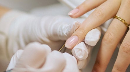 Close-up of a manicure session at Set Studio in Manchester, GB, showcasing glossy nails and professional care.