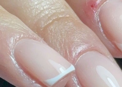 Beautiful French manicure at Haus of Rayah, Prestwich, England, GB. Perfectly polished for a chic look.