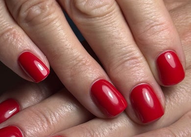 Red polished nails from Haus of Rayah, Prestwich, England, GB showcasing manicure beauty.