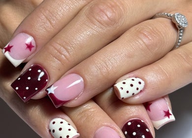 Starry maroon nail art at Haus of Rayah, Manchester, England, GB. Stylish and unique manicure design.