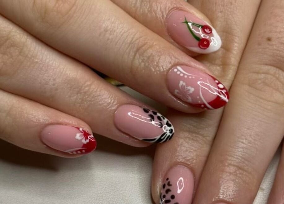 Elegant nail art design at Atelier, Stockton-on-tees, England, GB featuring floral and cherry accents.