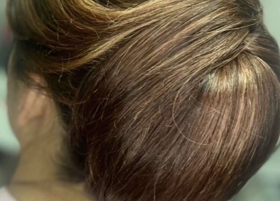 Elegant hair updo at Atelier in Stockton-on-tees, England, GB, showcasing expert styling and shine.