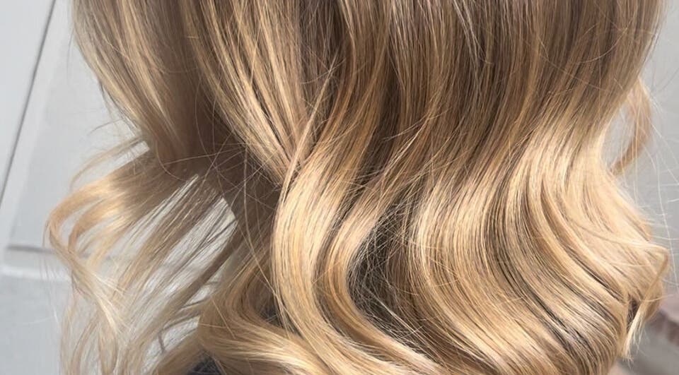 Blonde curls styled at Taryn Lee Hairdressing, Johannesburg, Gauteng, ZA reflecting elegant craftsmanship.