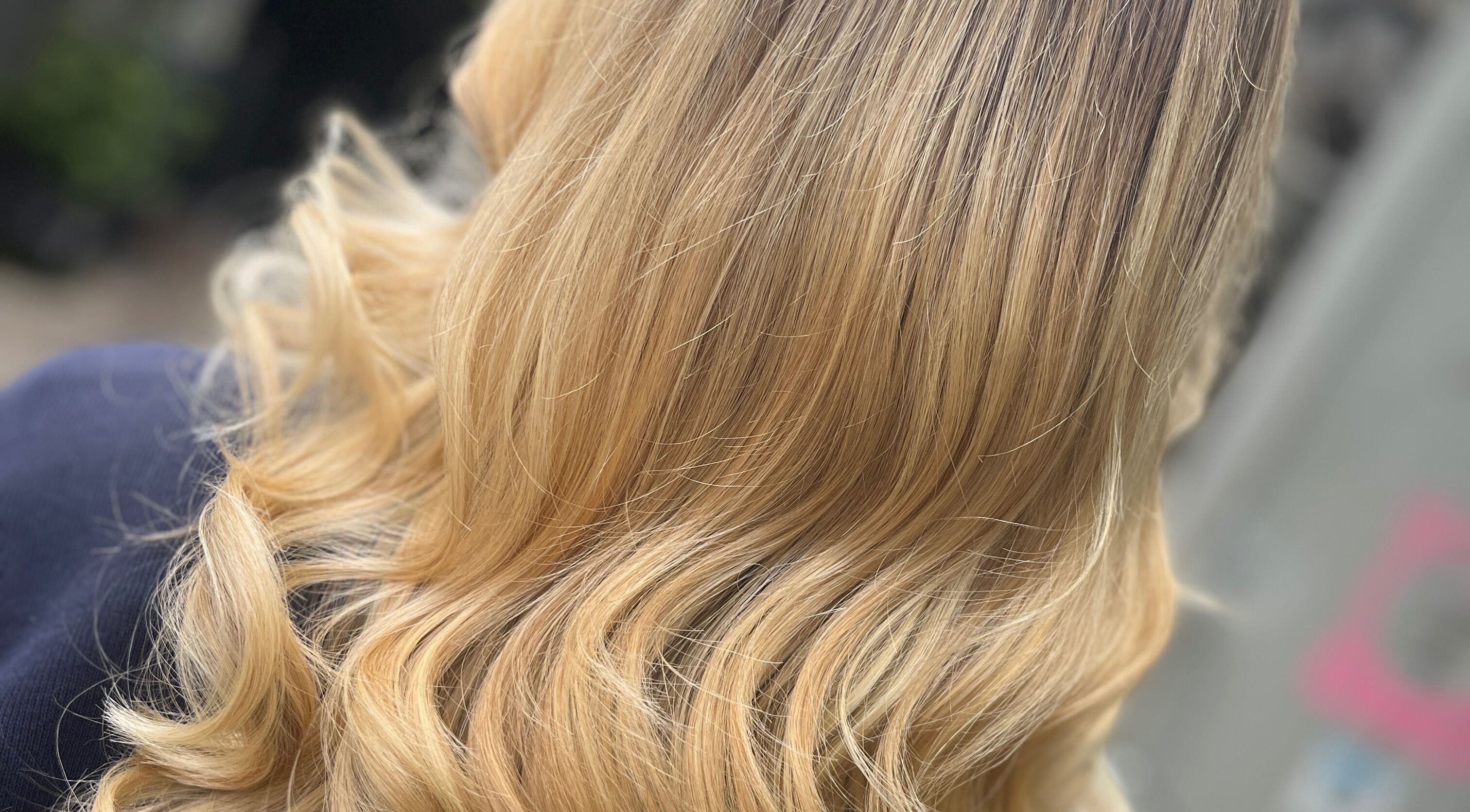 Elegant blonde curls styled at Taryn Lee Hairdressing, Johannesburg, Gauteng, ZA.
