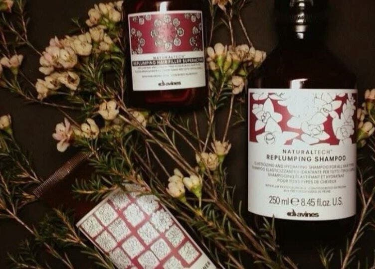 Haircare products with flowers at Taryn Lee Hairdressing, Johannesburg, Gauteng, ZA.