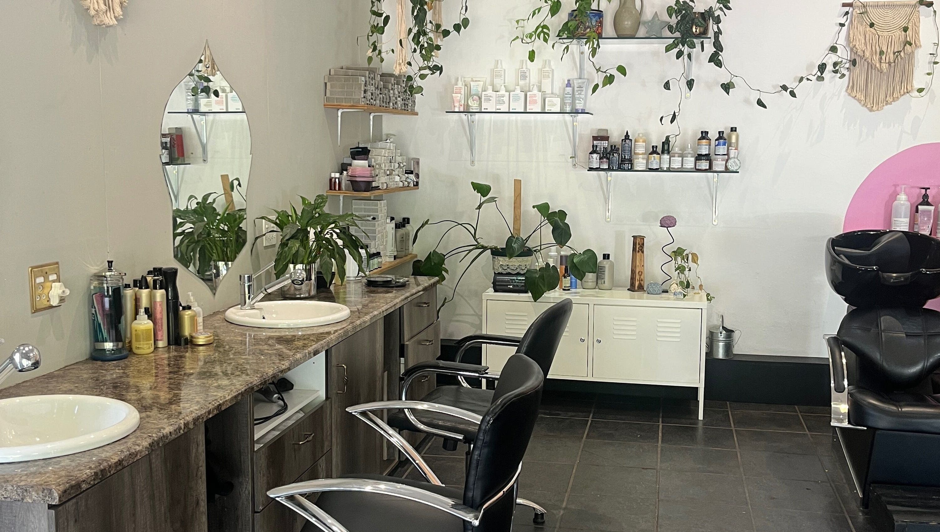 Modern interior of Taryn Lee Hairdressing in Johannesburg, Gauteng, ZA with stylish decor and comfortable seating.