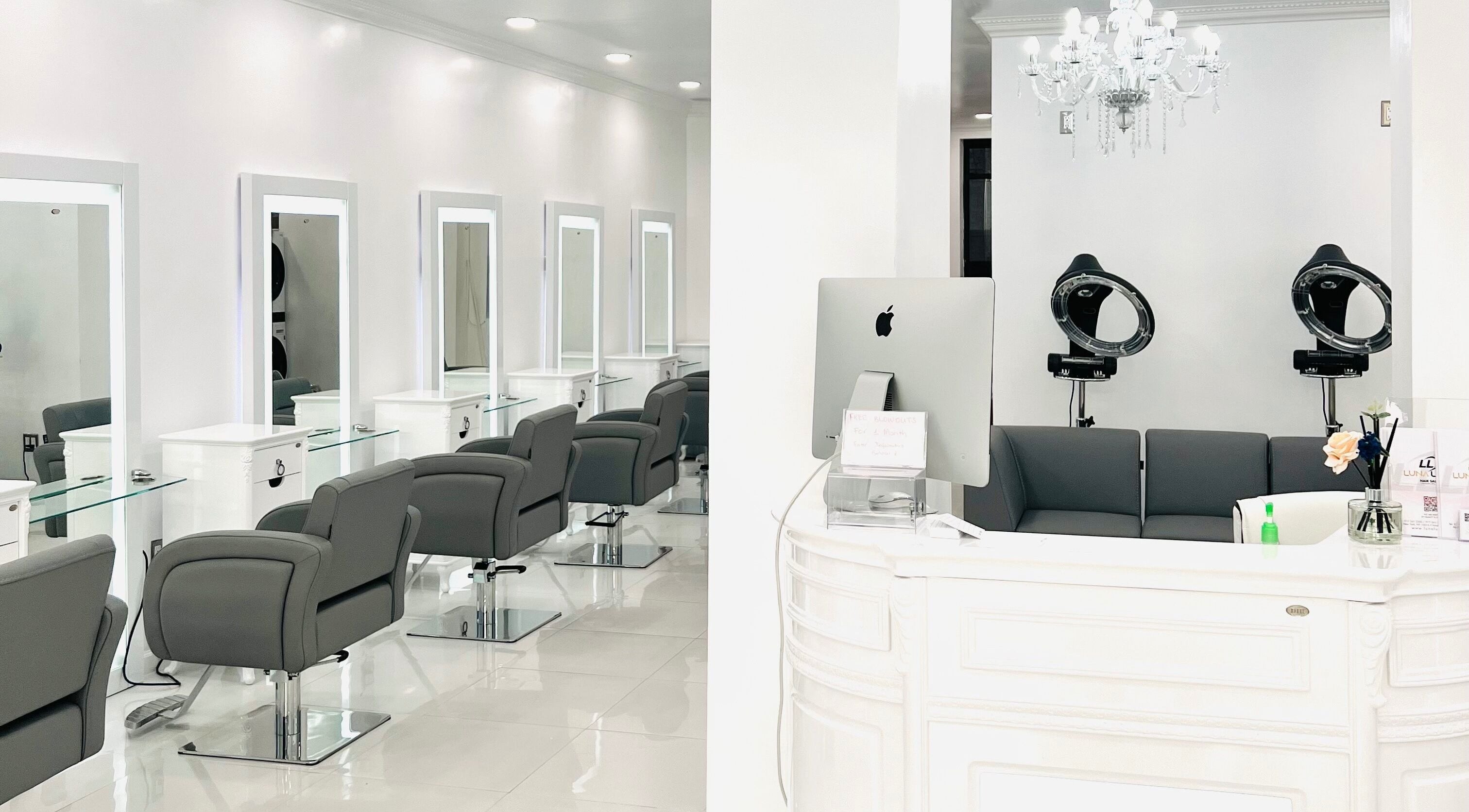 Elegant interior of Luna Lucci Hair Salon in New York, New York, US showcasing modern chairs and styling stations.