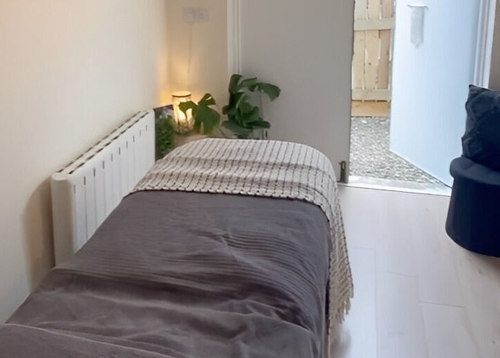 Cozy treatment room at Jessica Jay Salon, Perth, Scotland, GB, featuring a plush bed and ambient lighting.