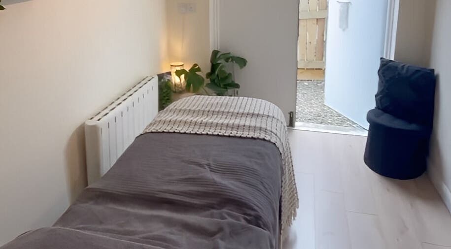 Cozy treatment room at Jessica Jay Salon, Perth, Scotland, GB, featuring a plush bed and ambient lighting.