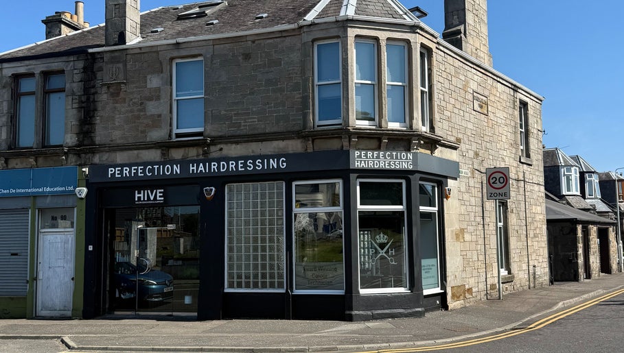 Exterior of Perfection Hairdressing in Kirkcaldy, Scotland, GB, showcasing its welcoming facade.