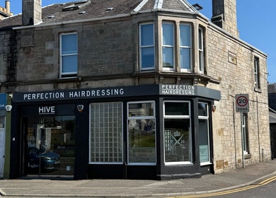 Exterior of Perfection Hairdressing in Kirkcaldy, Scotland, GB, showcasing its welcoming facade.
