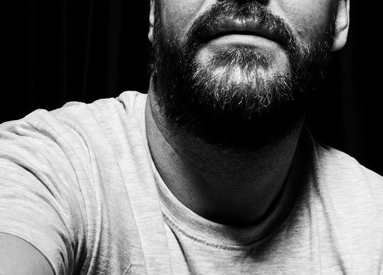 Monochrome close-up of a bearded person at Studio 2 Brighton, Brighton And Hove, England, GB.