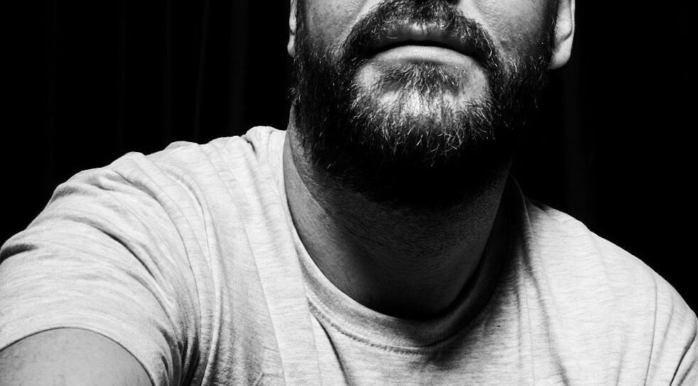 Monochrome close-up of a bearded person at Studio 2 Brighton, Brighton And Hove, England, GB.