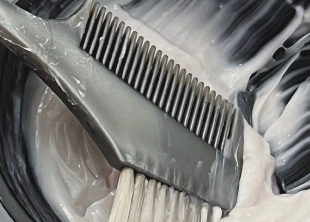 Hair dye brush in creamy color at Root & Remedy, Southampton, England, GB.