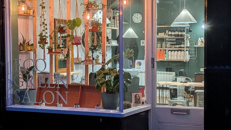 Inviting front view of The Eco Green Salon in Ulverston, England, GB, showcasing plants and eco-friendly decor.