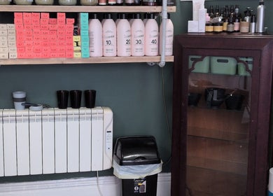 Hair products neatly arranged on salon shelves at The Eco Green Salon, Ulverston, England, GB.