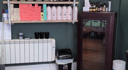 Hair products neatly arranged on salon shelves at The Eco Green Salon, Ulverston, England, GB.