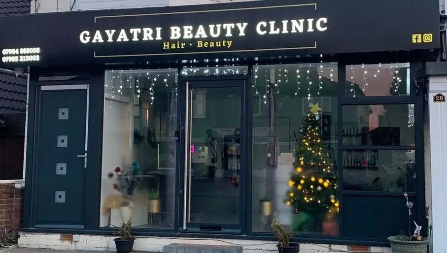 Front view of Gayatri Beauty Clinic, Leicester, England, GB with festive lights and Christmas decor.