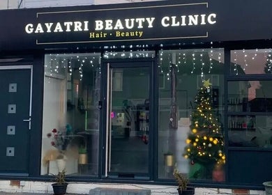 Front view of Gayatri Beauty Clinic, Leicester, England, GB with festive lights and Christmas decor.