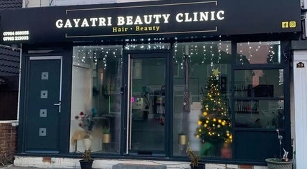 Elegant exterior of Gayatri Beauty Clinic adorned with festive lights in Leicester, England, GB.