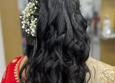 Elegant hairstyle with flowers at Gayatri Beauty Clinic, Leicester, England, GB.