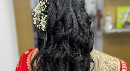 Elegant hairstyle with flowers at Gayatri Beauty Clinic, Leicester, England, GB.