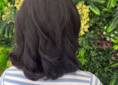 Glossy brunette hair styled beautifully at Gayatri Beauty Clinic, Leicester, England, GB.