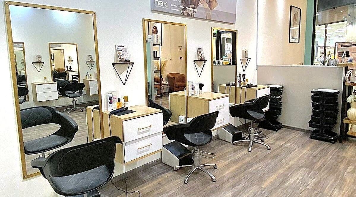 Stylish hair salon interior at Jem 3-Arts Village, Cape Town, Western Cape, ZA with mirrors and salon chairs.