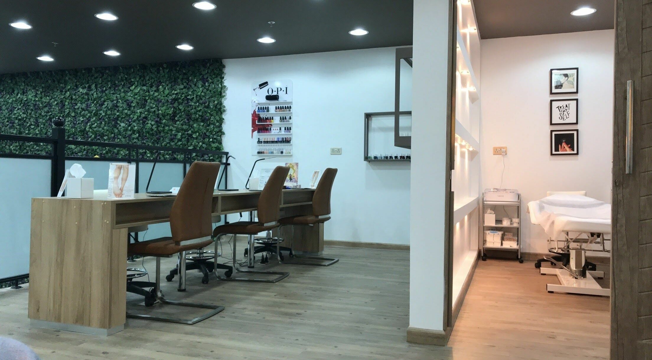 Interior of Trends Beauty Bar in Ras Al-Khaimah, AE, featuring nail stations and treatment room.