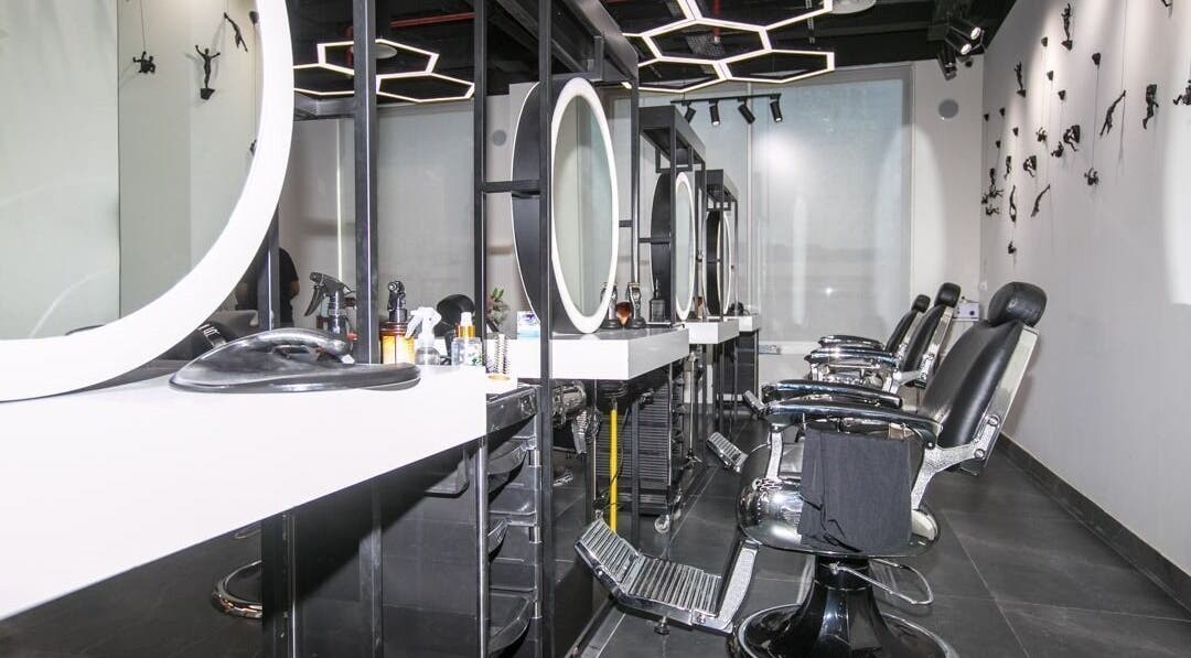Stylish interior of Hair Lounge Gents Salon in Dubai, Dubai, AE, featuring modern salon chairs and mirrors.