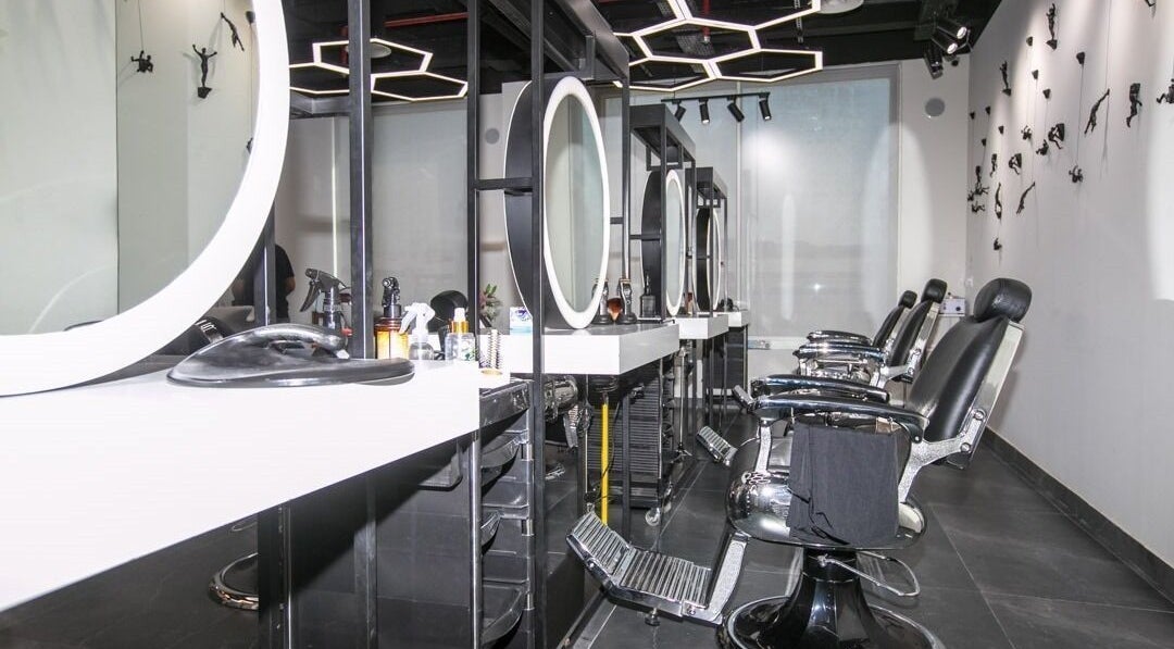 Stylish interior of Hair Lounge Gents Salon in Dubai, Dubai, AE, featuring modern salon chairs and mirrors.