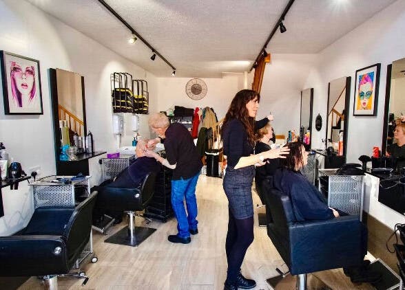 Stylists working at Zest Studio salon in Colchester, England, GB, creating a vibrant beauty experience.