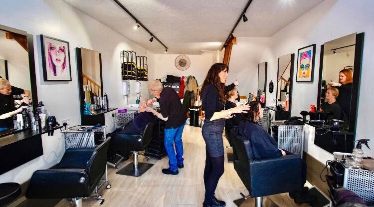Stylists working at Zest Studio salon in Colchester, England, GB, creating a vibrant beauty experience.