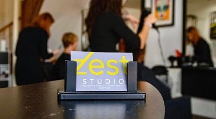 Zest Studio card holder on counter in Colchester, England with hairstylists working in the background.