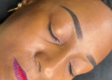 Close-up of flawless eyebrow and vibrant lips treatment at Stardust Beauté Studio, Bridgetown, Saint Michael, BB.