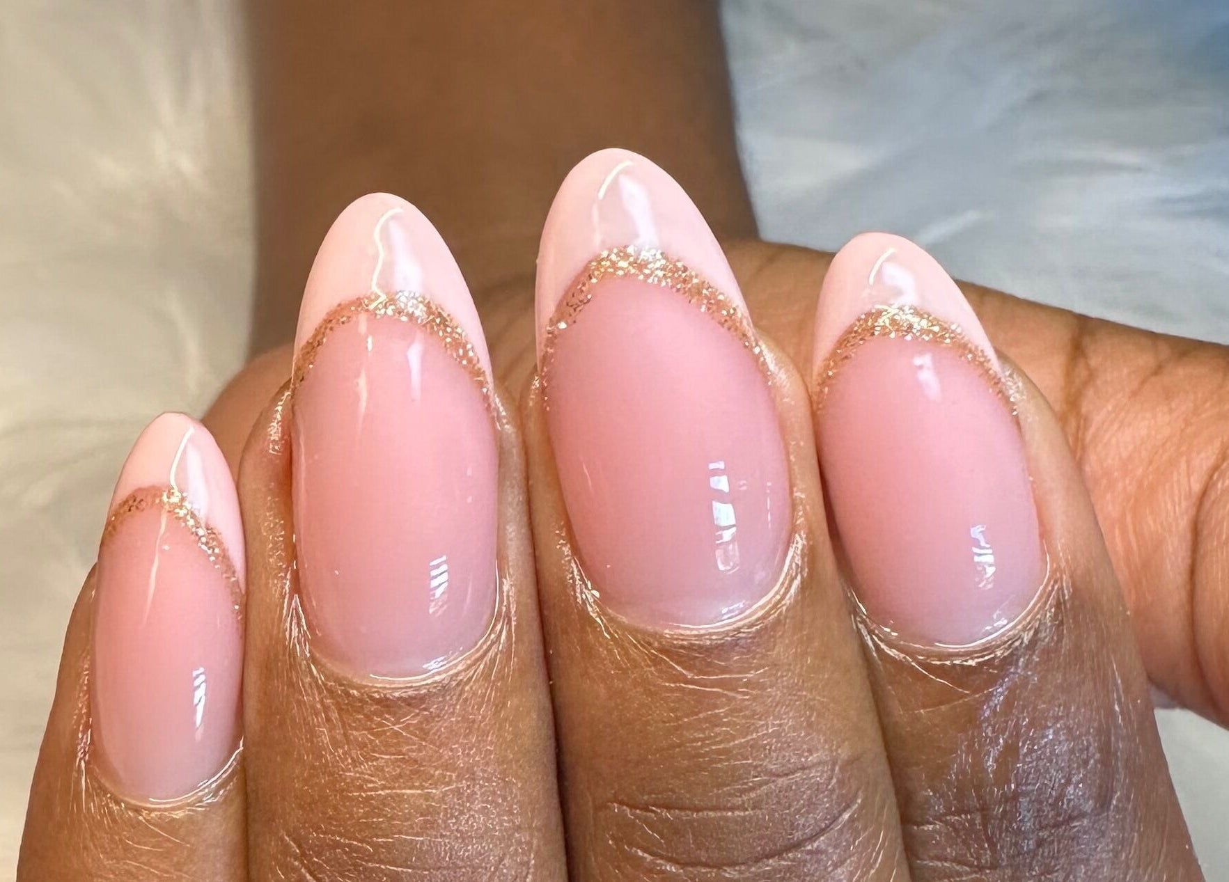 Elegant pink nails with gold accents at Stardust Beauté Studio, Bridgetown, Saint Michael, BB.